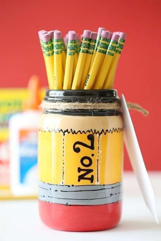 A pencil holder with a yellow pencil inside, ready for use at Color Café.