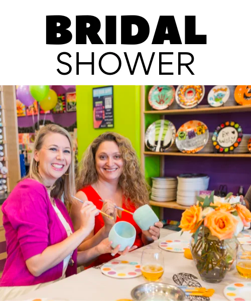 Two women painting pottery together at a bridal party, enjoying a creative and fun celebration at Color Café.